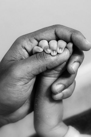 holding-hands-paternity-concept_181624-26808